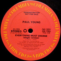 Open book titled "Everything Must Change" by Rectangle Triangle, showing a clean, modern cover design.