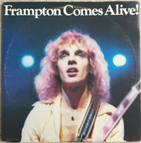 Rectangle Triangle Frampton Comes Alive! album cover artwork featuring bold, colorful design with band name and album title.