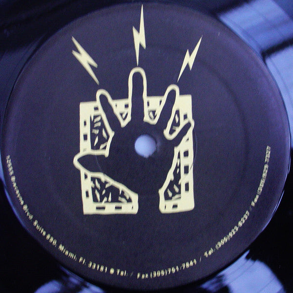 Rectangle Triangle's "It's Alright" vinyl record featuring colorful abstract artwork on the cover.